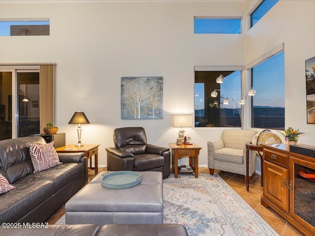 tiled living room with a high ceiling