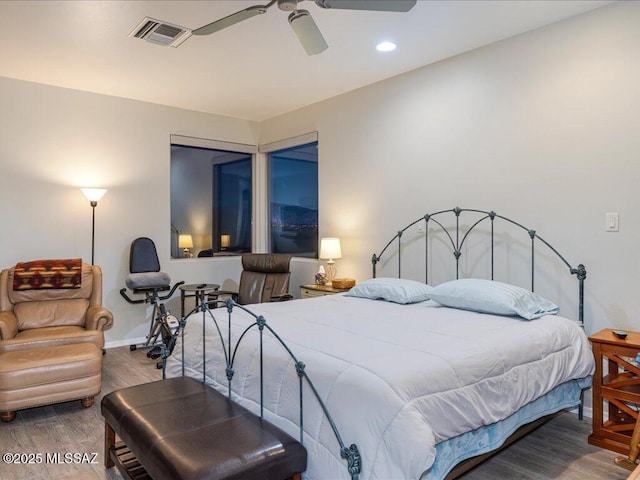 bedroom featuring wood-type flooring and ceiling fan