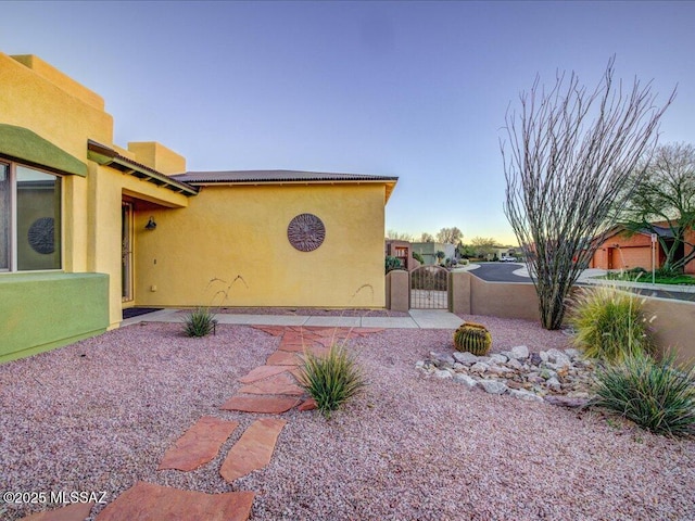 view of property exterior at dusk