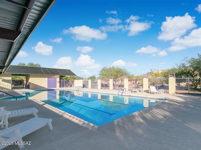 view of swimming pool featuring a patio area