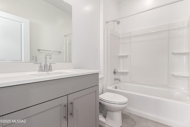 full bathroom with tub / shower combination, tile patterned floors, vanity, and toilet