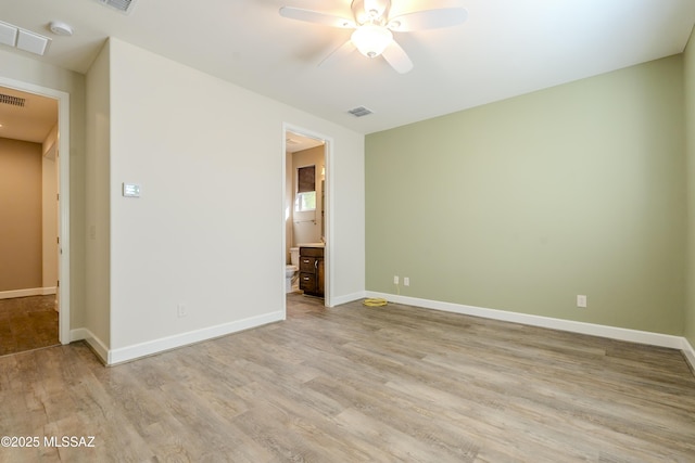 spare room with ceiling fan and light hardwood / wood-style flooring