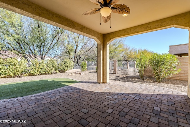 view of patio featuring ceiling fan