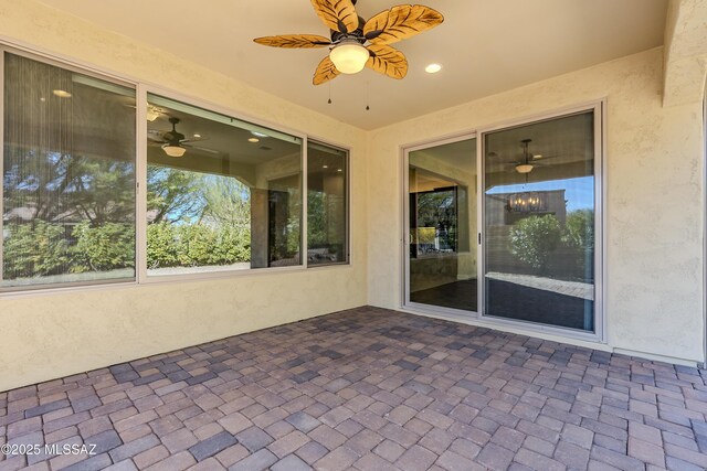 view of patio featuring ceiling fan