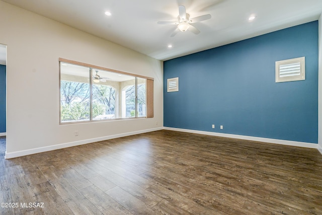 unfurnished room featuring ceiling fan and dark hardwood / wood-style floors