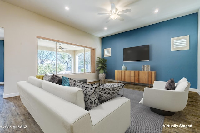 living room with ceiling fan and wood-type flooring