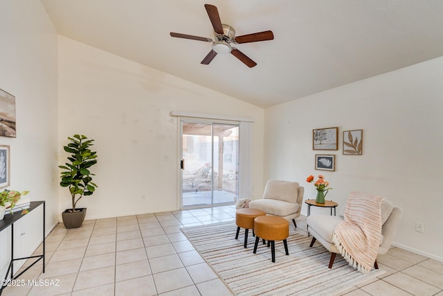 living area with lofted ceiling, light tile patterned floors, and ceiling fan