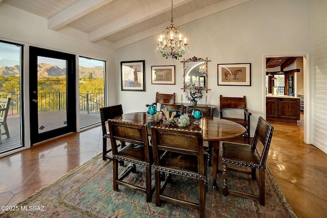 tiled dining room featuring wood ceiling, beam ceiling, high vaulted ceiling, a notable chandelier, and a mountain view