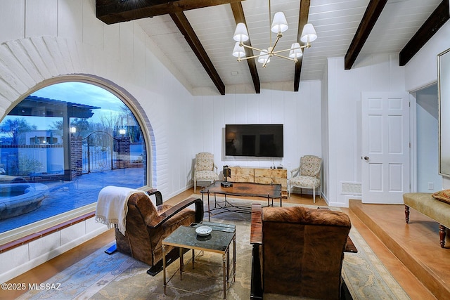 living room with lofted ceiling with beams, wood-type flooring, wooden ceiling, and a chandelier