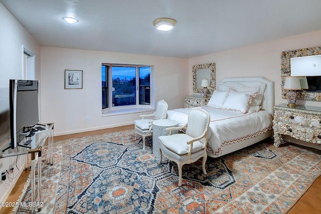 sitting room with wood-type flooring