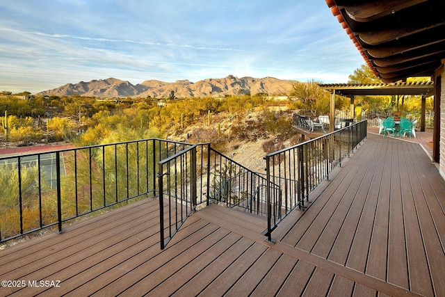 deck with a mountain view and a pergola