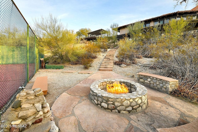 view of patio with a fire pit