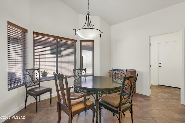 dining area featuring lofted ceiling