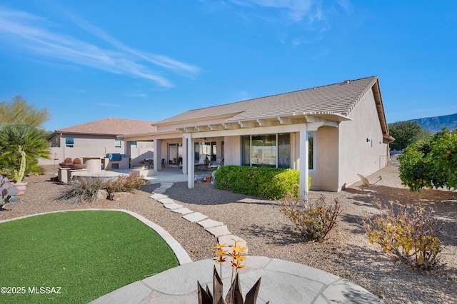 rear view of property with a patio