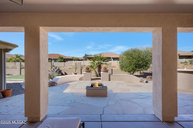 view of patio with a fire pit