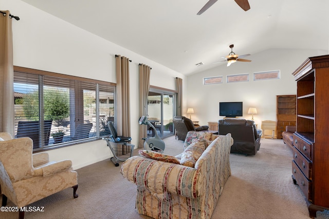 carpeted living room with high vaulted ceiling and ceiling fan