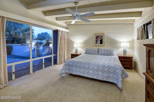 carpeted bedroom featuring ceiling fan and beamed ceiling