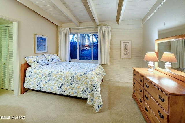 bedroom with light colored carpet and beam ceiling