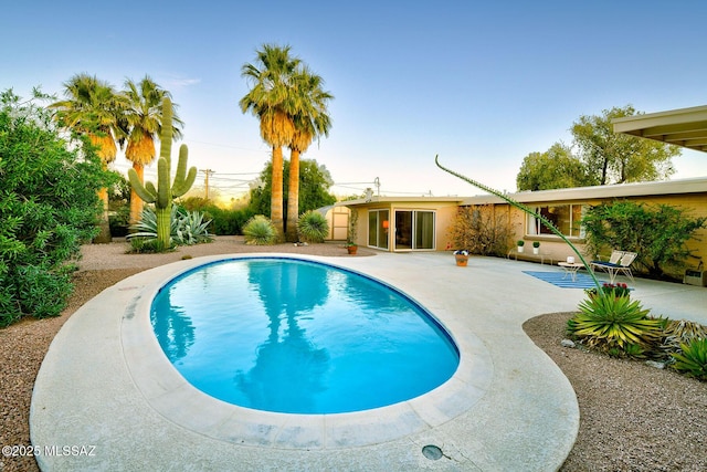 pool with a patio area