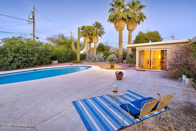 outdoor pool with a patio