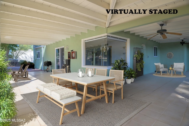 view of patio with area for grilling and ceiling fan