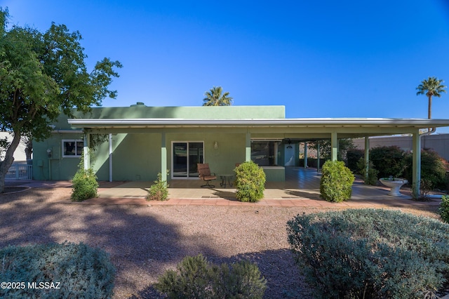 back of property with a patio area