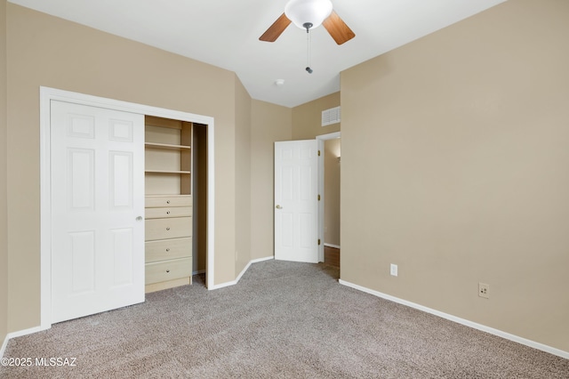 unfurnished bedroom with carpet floors, a closet, and ceiling fan