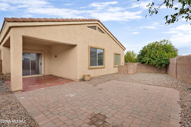 back of house with a patio area
