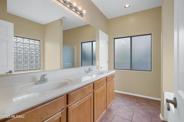 bathroom featuring tile patterned flooring and vanity