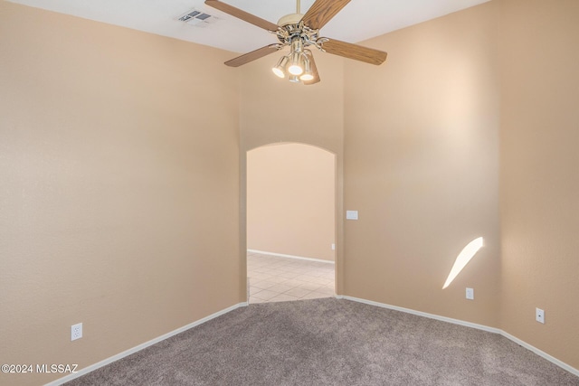 carpeted empty room with ceiling fan