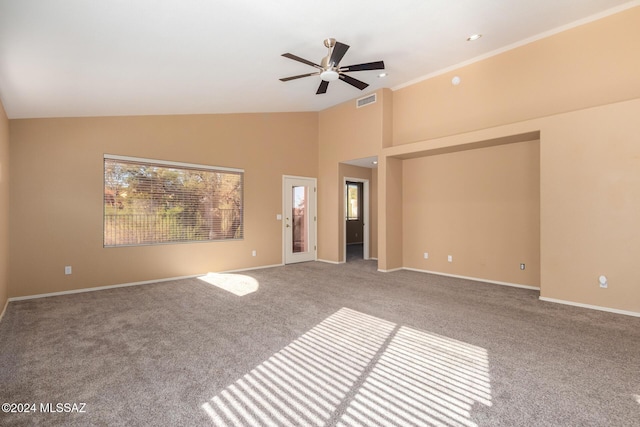 empty room with ceiling fan, carpet flooring, and high vaulted ceiling