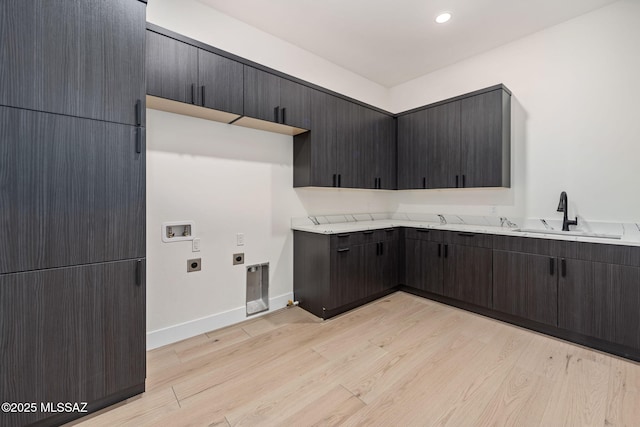 kitchen with light hardwood / wood-style floors and sink