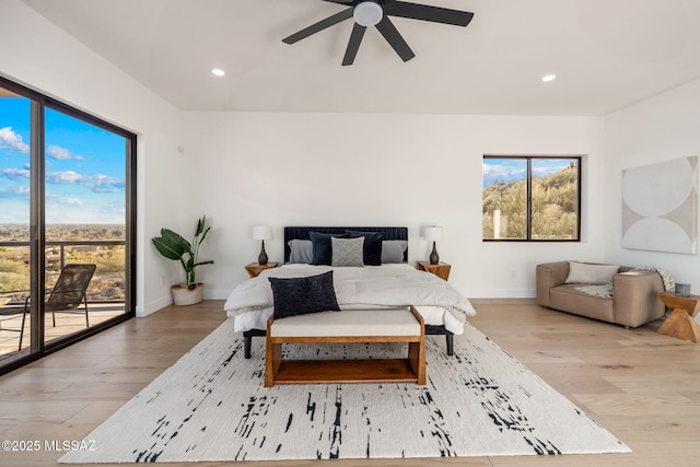 bedroom with ceiling fan, access to exterior, and light hardwood / wood-style flooring