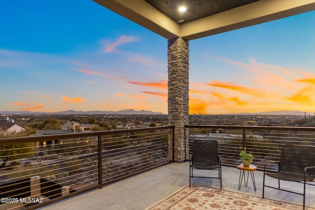 view of balcony at dusk