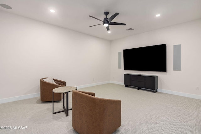 interior space featuring ceiling fan and carpet