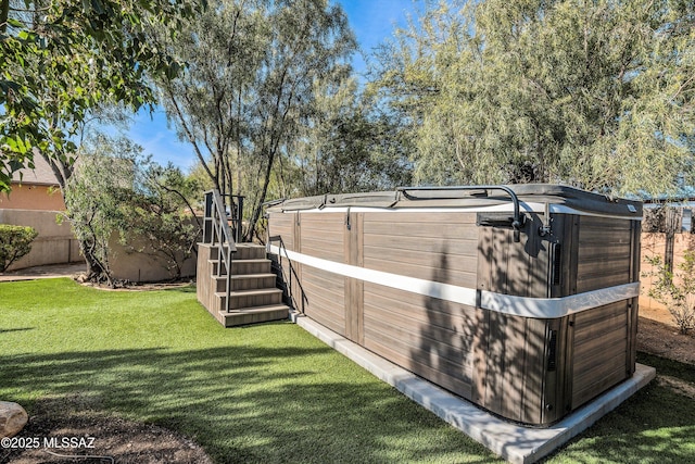 view of yard with a hot tub