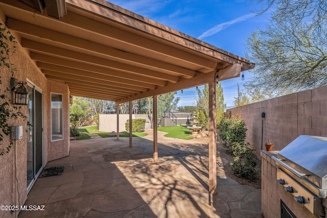 view of patio with a grill