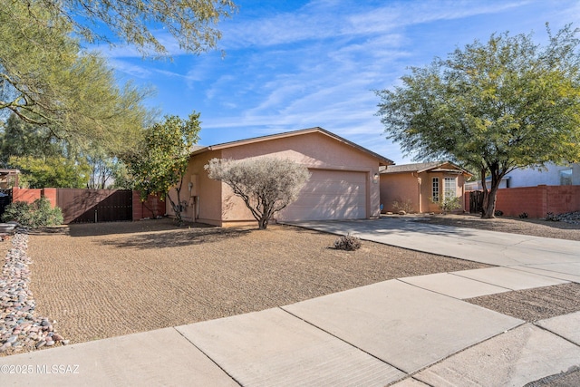 ranch-style home featuring a garage