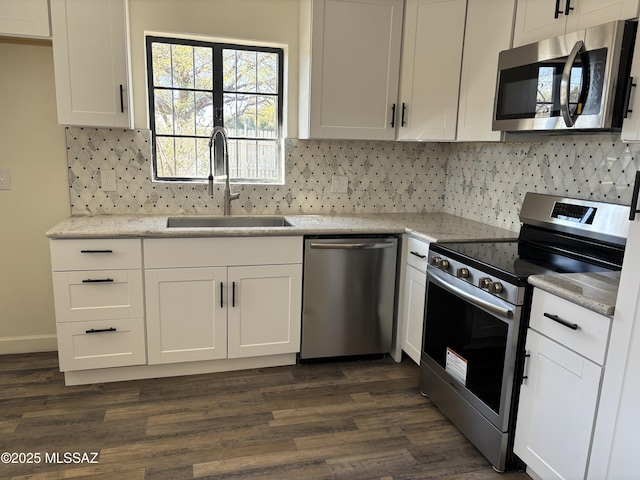 kitchen featuring sink, white cabinetry, and stainless steel appliances