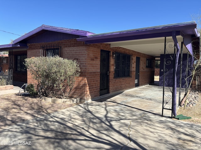 exterior space with a carport