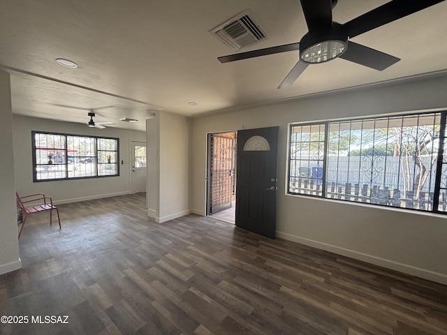 foyer with ceiling fan and dark wood-type flooring