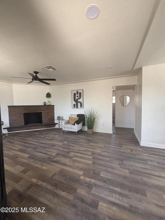 living room with ceiling fan, dark hardwood / wood-style floors, and ornamental molding