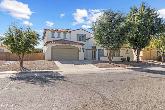 mediterranean / spanish-style home with a garage