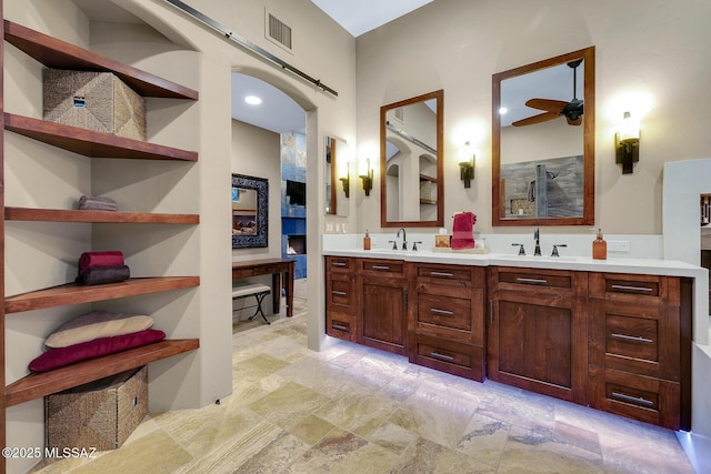 bathroom featuring vanity and ceiling fan