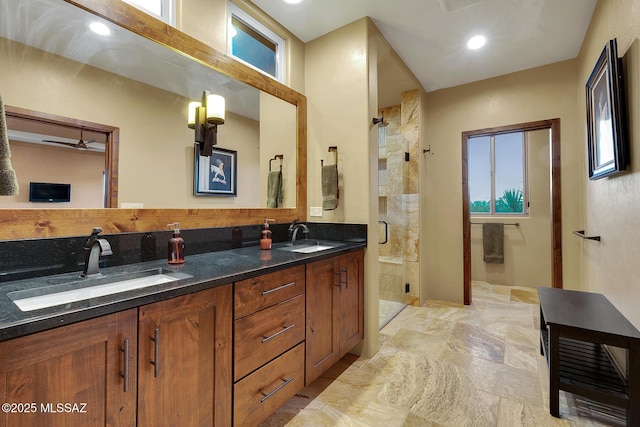 bathroom featuring walk in shower and vanity