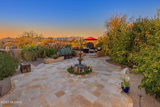 patio terrace at dusk with a mountain view