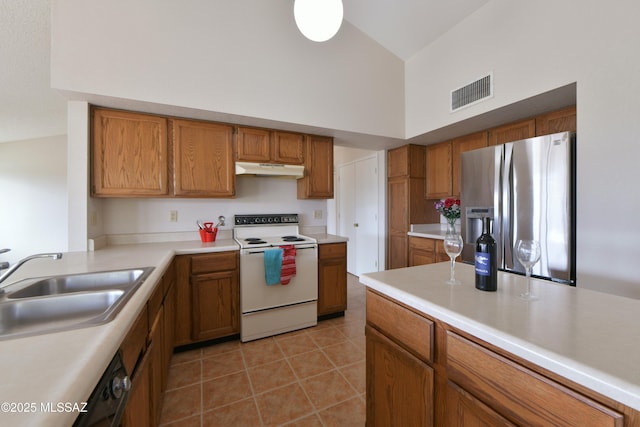 kitchen featuring stainless steel fridge with ice dispenser, brown cabinetry, high vaulted ceiling, white range with electric stovetop, and a sink