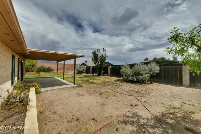 view of yard featuring a patio area and fence