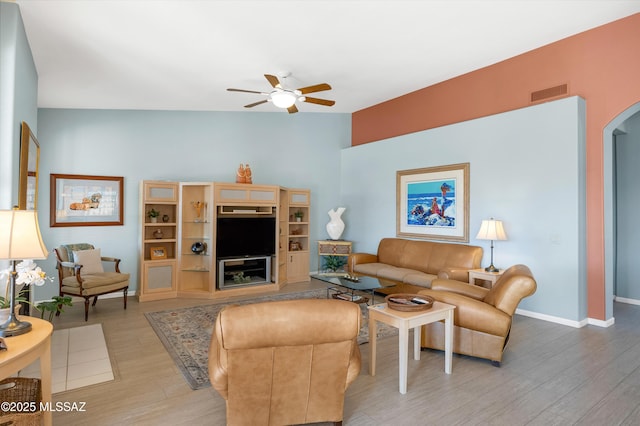 living room featuring ceiling fan and light hardwood / wood-style floors