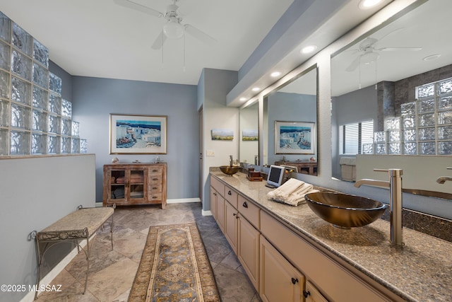 bathroom with ceiling fan and vanity